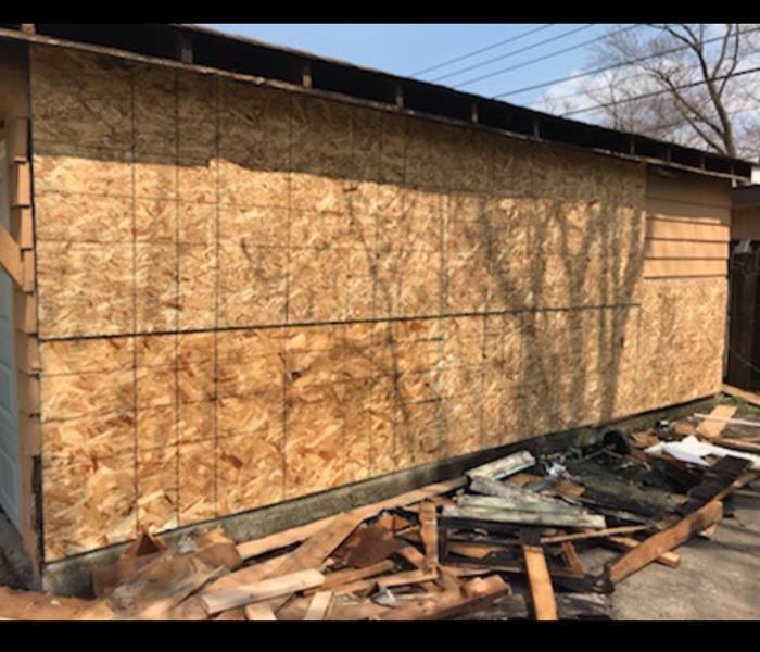 Garage boarded up after fire damage 